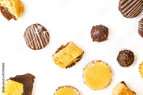 various chocolate covered cakes on white background