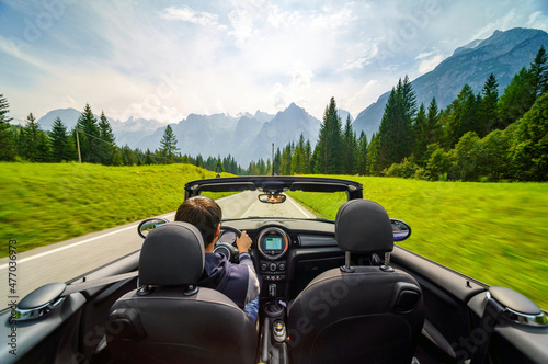 фотографія Driver's hands on a steering wheel of a convertible car