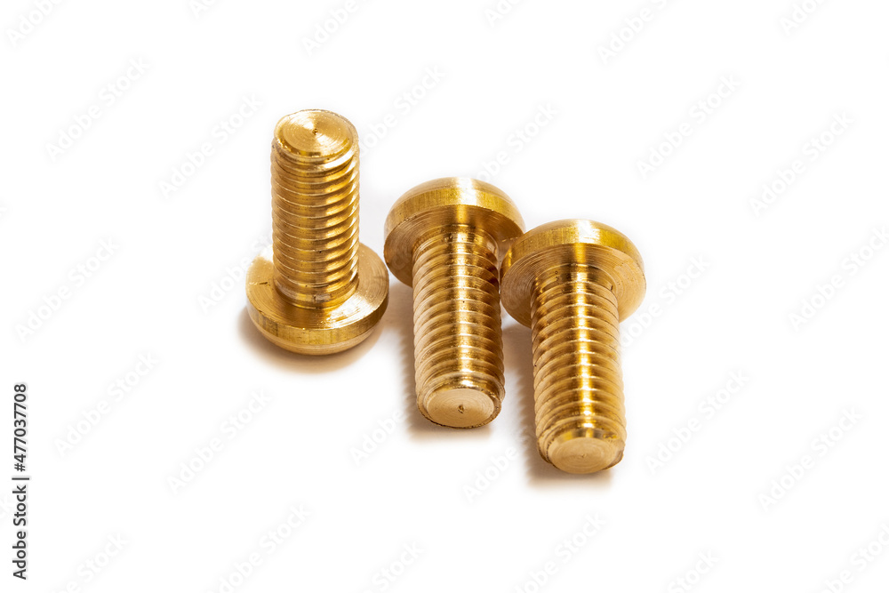 Bronze screws on a white background, made on a lathe. Bronze screws on a white background, made on a lathe.