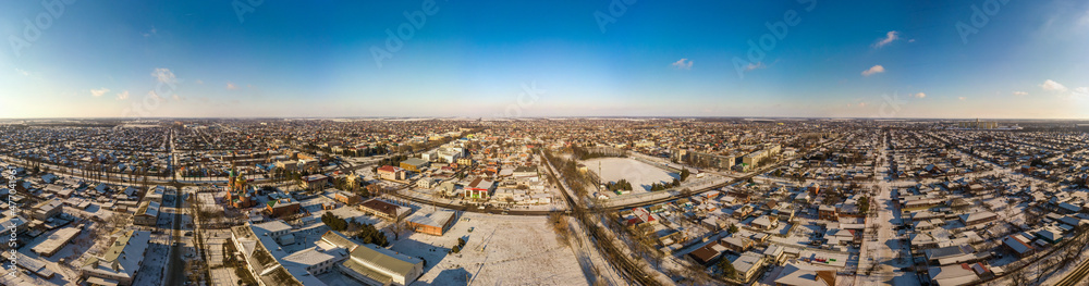 winter panoramic landscape of Korenovsk city (South of Russia) - snow-covered courtyards and low-rise buildings
