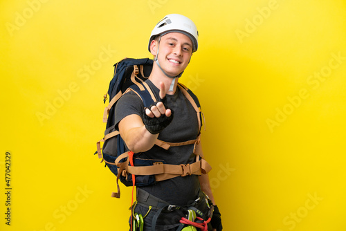 Young rock climber Brazilian man showing and lifting a finger