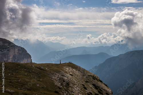 clouds over mountain trail Tre Cime di Lavaredo in Dolomites in Italy