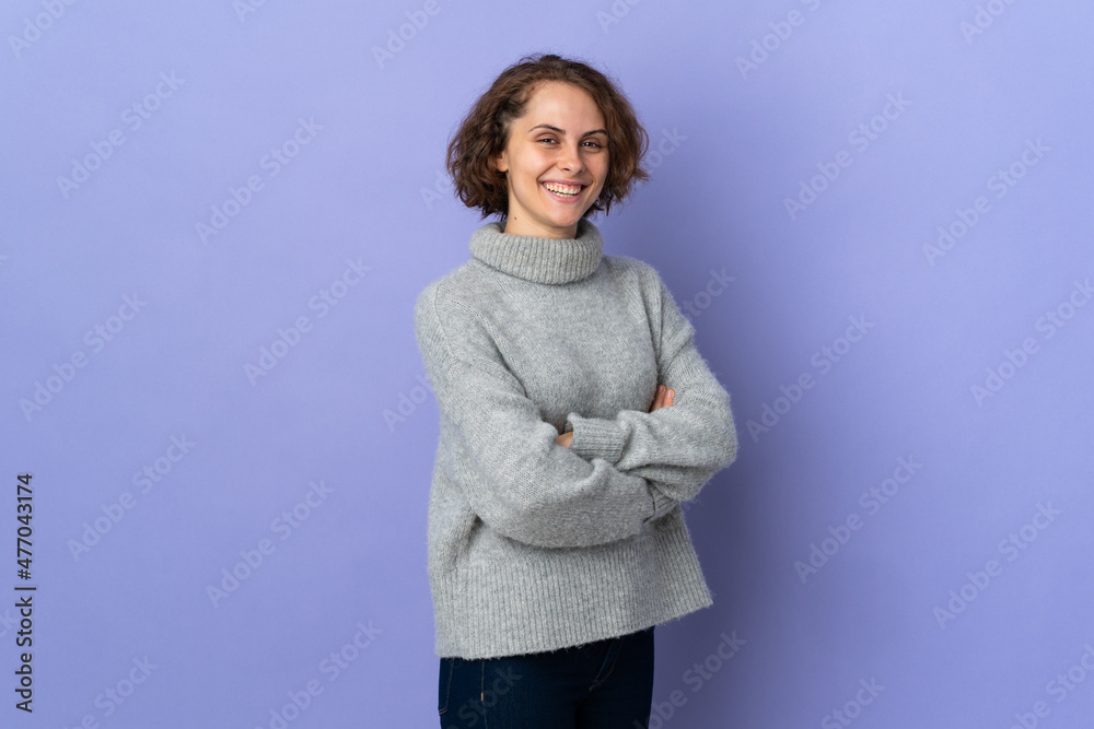 Young English woman isolated on purple background with arms crossed and looking forward Young English woman isolated on purple background with arms crossed and looking forward
