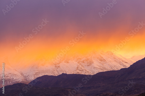 Sunrise over snow covered mountains in Patagonia, Chile 