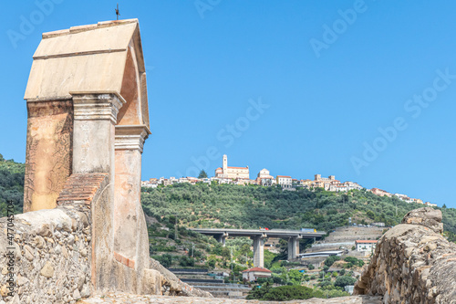 the ancient roman bridge in Taggia with Castellaro in background photo