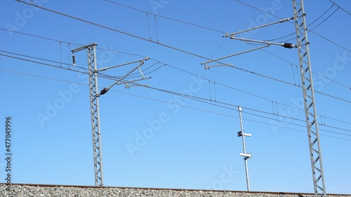 electric train catenary against sky background