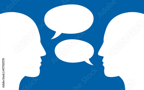 Two human heads silhouette talking through speech bubbles. Dialogue,contact, conversational exchange between two individuals.