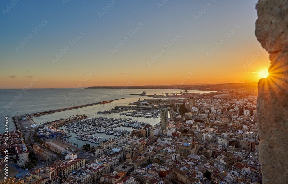 Alicante city port at sunset. Alicante view town since Santa Barbara castle, Spain