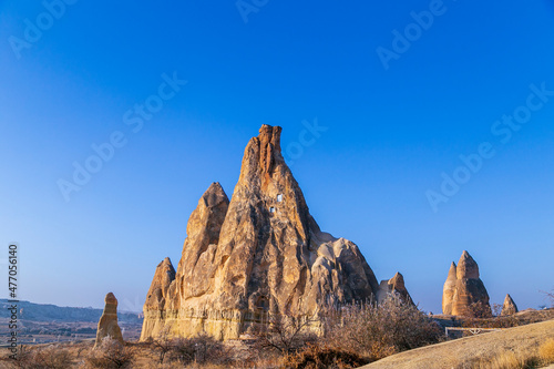 Volcanic rock landcsape of Fairy tale chimneys in Cappadocia with blue sky on background 
