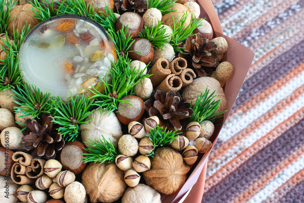 Nut composition with green pine branches