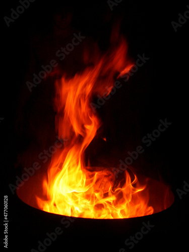 Fire barrel flames with black background.