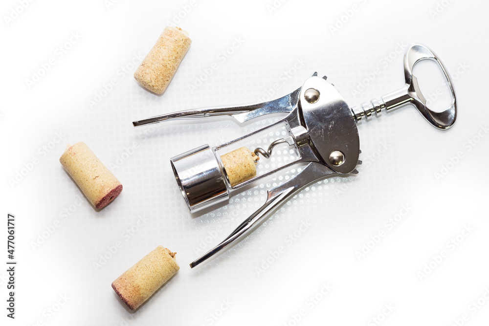 corkscrew with wine corks, on an isolated background corkscrew with wine corks, on an isolated background