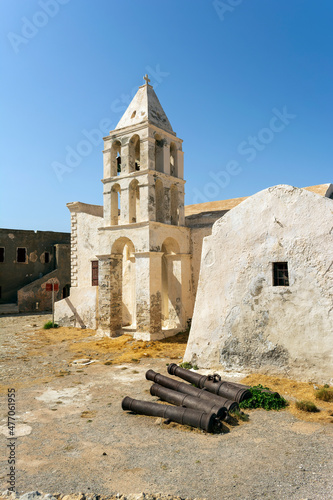 Panagia Myrtidiotissa old Medieval Greek Orthodox Church at Chora Kythira island, Kithira, Greece. Belfry two bells stonewall building. photo