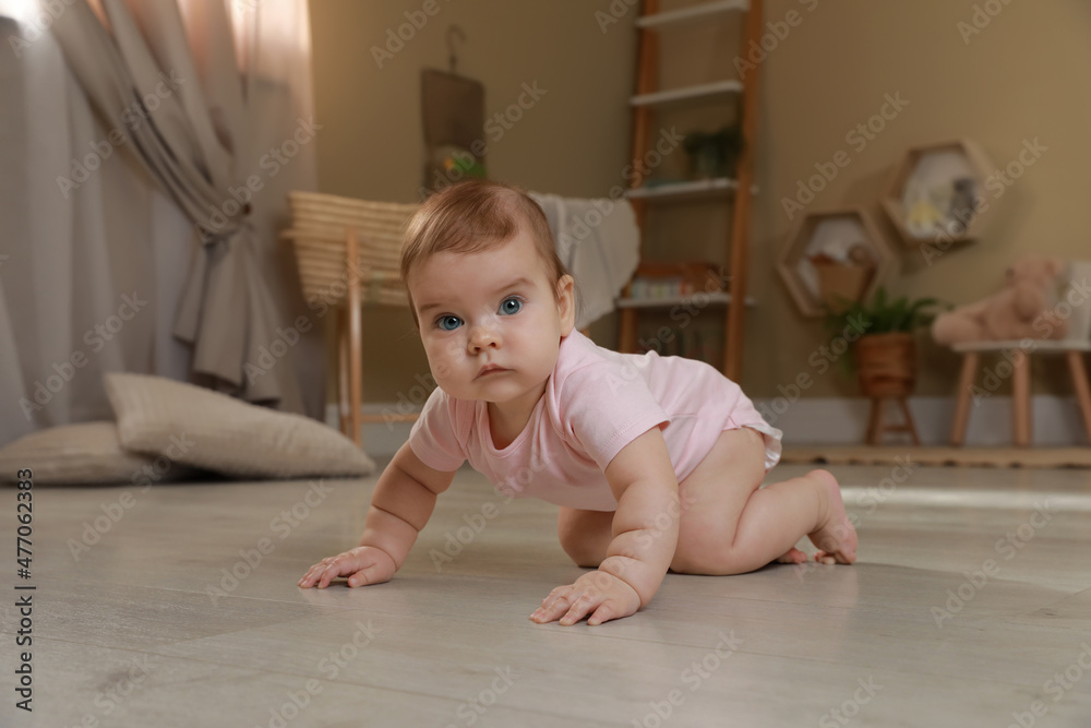 Cute baby crawling on floor at home Cute baby crawling on floor at home