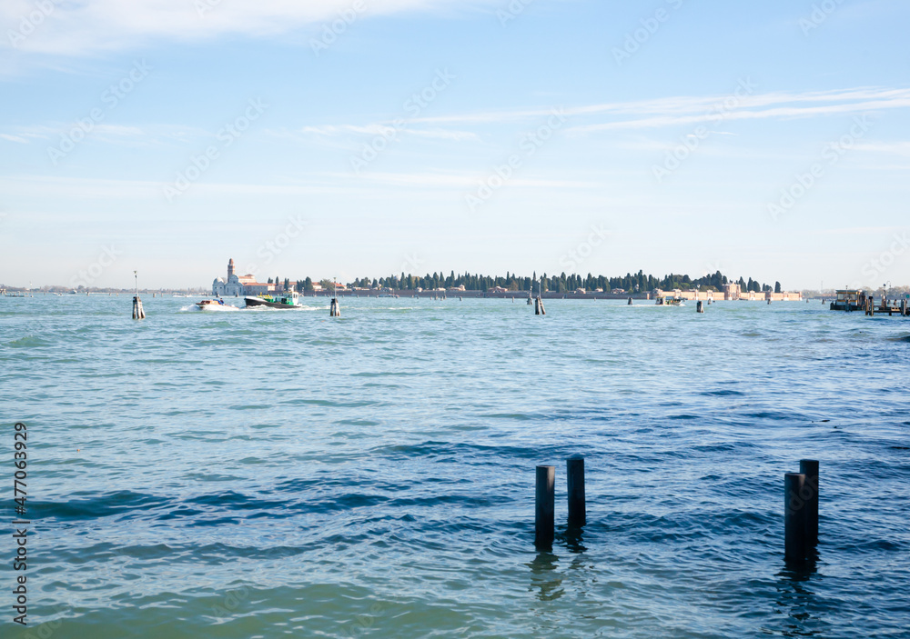 Venice typical landscape. Boat floating on canal. Italian landmark.