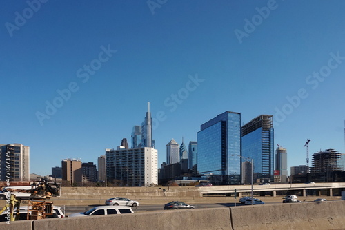 Blue Glass Towers White and Brick High Rises Beyond the Expressway in Philadelphia on a Sunny Winter Day with Blue Sky