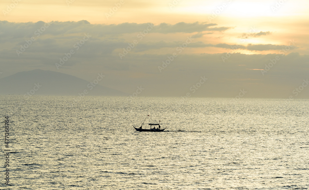 A gorgeous sunset over the Pacific Ocean with silhouette shots of fishing boats. A gorgeous sunset over the Pacific Ocean with silhouette shots of fishing boats.