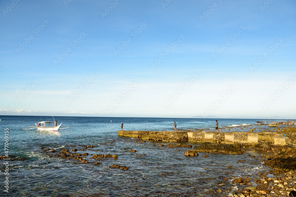 A midday supply run with a Filipino fishing banka in Batangas. A midday supply run with a Filipino fishing banka in Batangas.