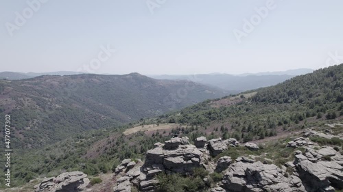 video with drone flying parc national des cevennes france with a single person on the horizon photo