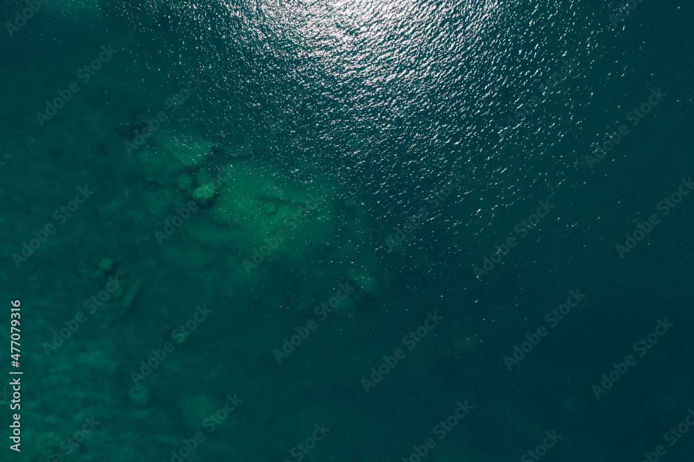 Sea surface aerial view, Bird eye view photo of seafoam waves, and water surface texture. Amazing view Top-down - obrazy, fototapety, plakaty 