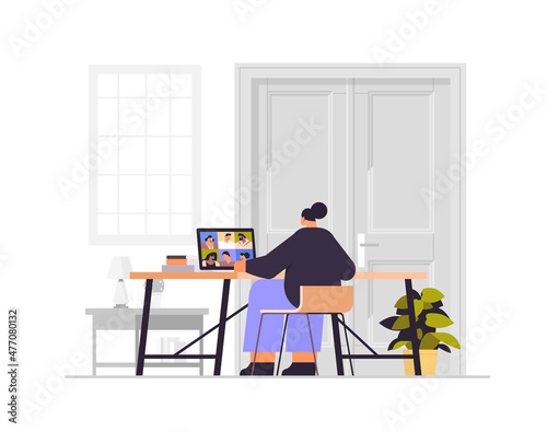 businesswoman discussing with mix race colleagues on laptop screen during video call virtual conference