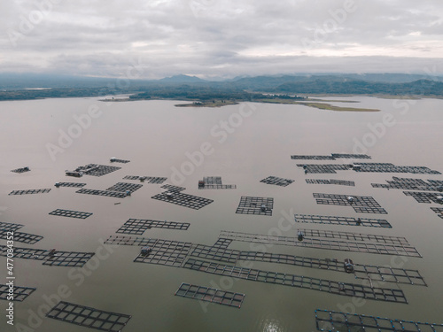 Aerial view of traditional floating fish pond on lake in Indonesia photo