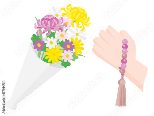 仏教のお供えの花と拝む手
