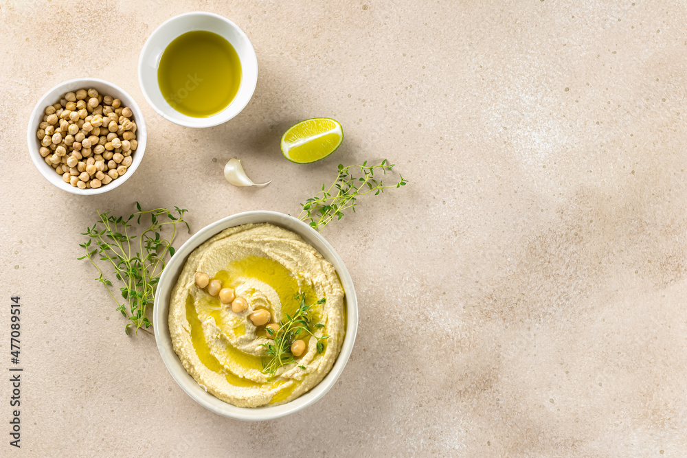 Healthy homemade hummus, made with tahini, lime, olive oil, and chickpeas. Perfect for dipping and can be used in sandwiches, salads, and burgers. Flat lay, copy space for the recipe. Healthy homemade hummus, made with tahini, lime, olive oil, and chickpeas. Perfect for dipping and can be used in sandwiches, salads, and burgers. Flat lay, copy space for the recipe.