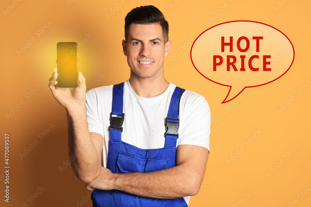 Smartphone repairing by hot price. Man with mobile phone on orange background Smartphone repairing by hot price. Man with mobile phone on orange background