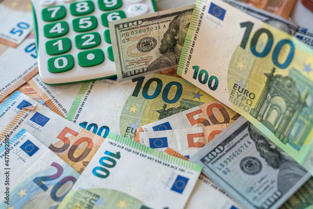 concept of exchange of dollars and euros with calculator concept of exchange of dollars and euros with calculator