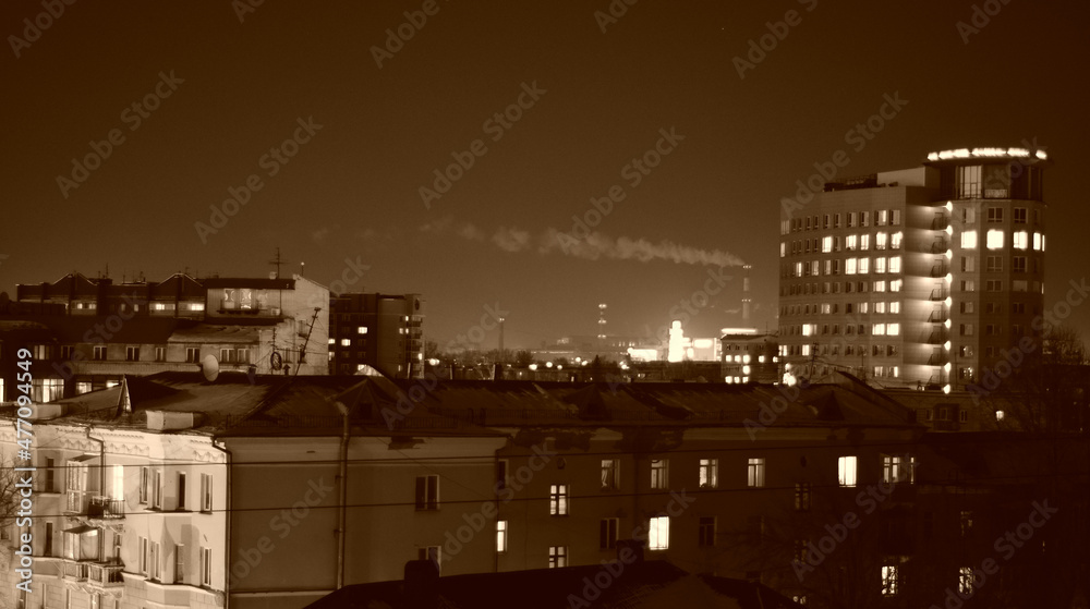 Chimney with smoke on the background of a winter city