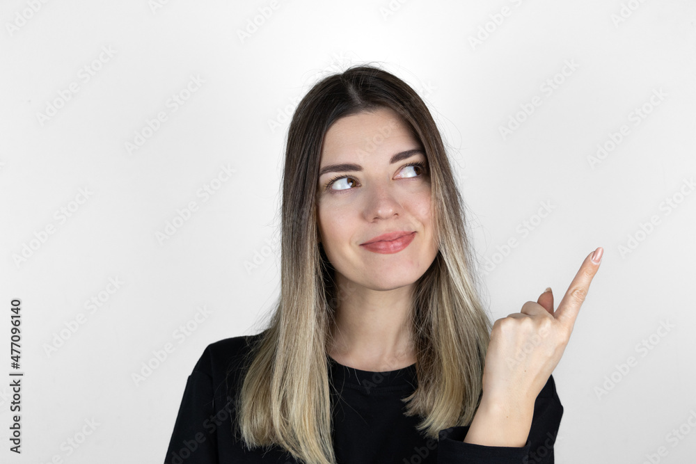 Young girl is thinking. Good idea coming to pretty girl's mind, solution of problems on white background. Smiling with thoughtful face. Brilliant mind concept. Young girl is thinking. Good idea coming to pretty girl's mind, solution of problems on white background. Smiling with thoughtful face. Brilliant mind concept.