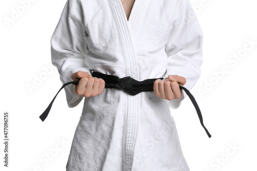 Obraz na plátně Martial arts master in keikogi with black belt on white background, closeup