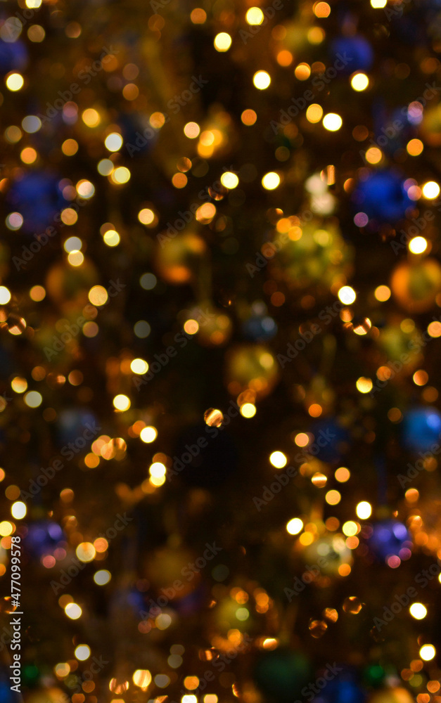 Christmas background. Empty wooden table on the background of the Christmas tree and New Year's golden bokeh.Ready for product montage. Copy space