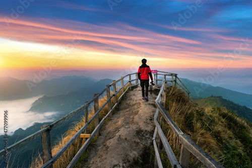 Tourist walking on Phu chi dao mountain at sunrise in Chiang Rai province, Thailand. photo