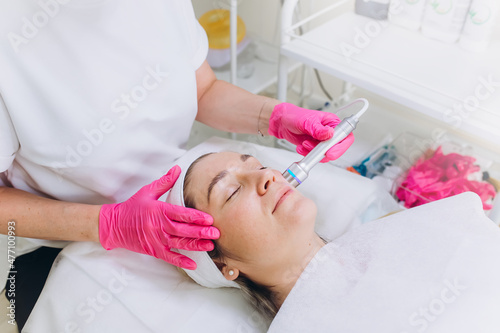 Cosmetic professional face spa procedure in beauty salon