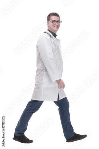 in full growth. doctor with stethoscope striding forward . © ASDF