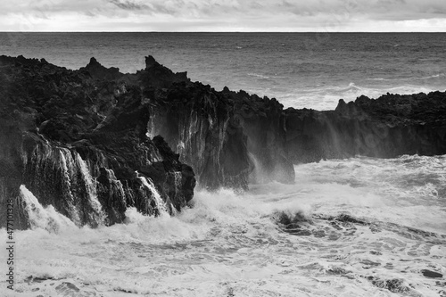 Volcanic coast with high tide waves in Ponta da Ferraria, San Miguel, Azores, Portugal photo