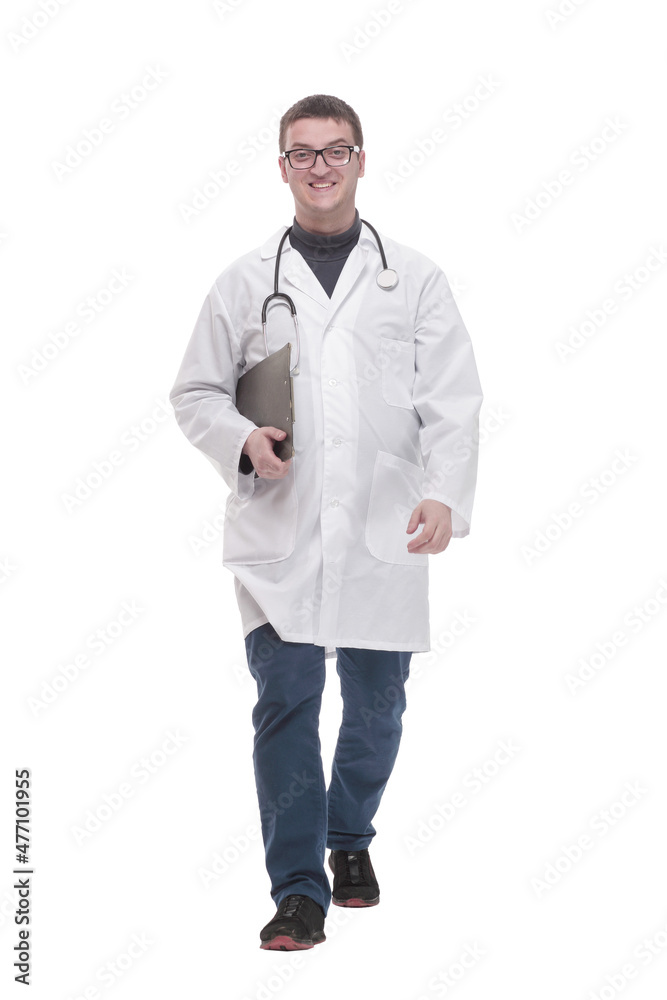 in full growth. confident male doctor with clipboard. in full growth. confident male doctor with clipboard.