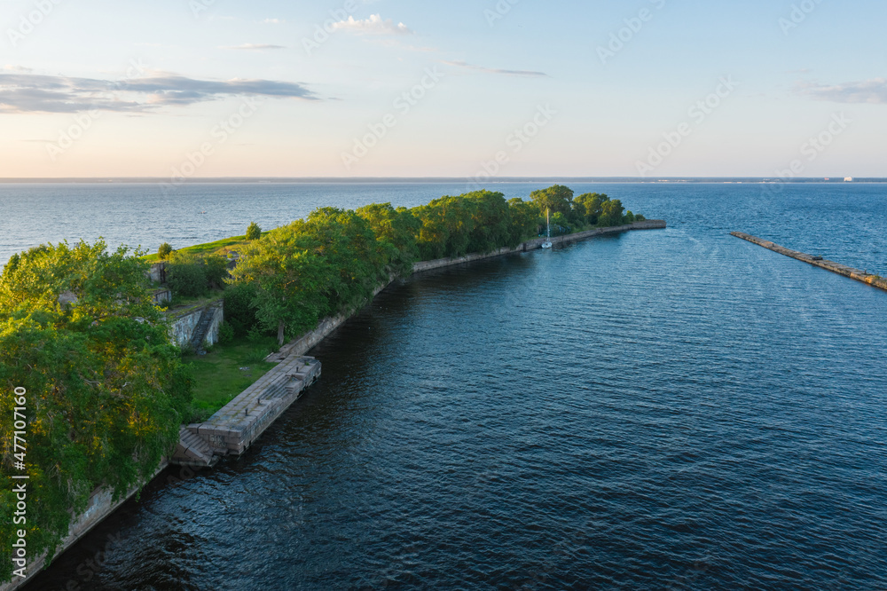 Panoramic aerial view of Fort Totleben Pervomaisky on a summer day in the waters of the Gulf of Finland.One of the fortifications of Kronstadt.Kronstadt Fortress. Concrete walls and ridges under water