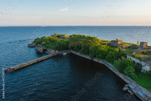 Panoramic aerial view of Fort Totleben Pervomaisky on a summer day in the waters of the Gulf of Finland.One of the fortifications of Kronstadt.Kronstadt Fortress. Concrete walls and ridges under water photo