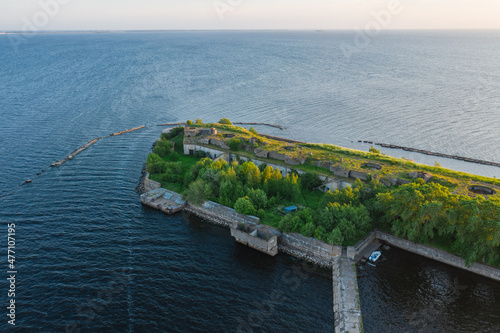 Panoramic aerial view of Fort Totleben Pervomaisky on a summer day in the waters of the Gulf of Finland.One of the fortifications of Kronstadt.Kronstadt Fortress. Concrete walls and ridges under water photo