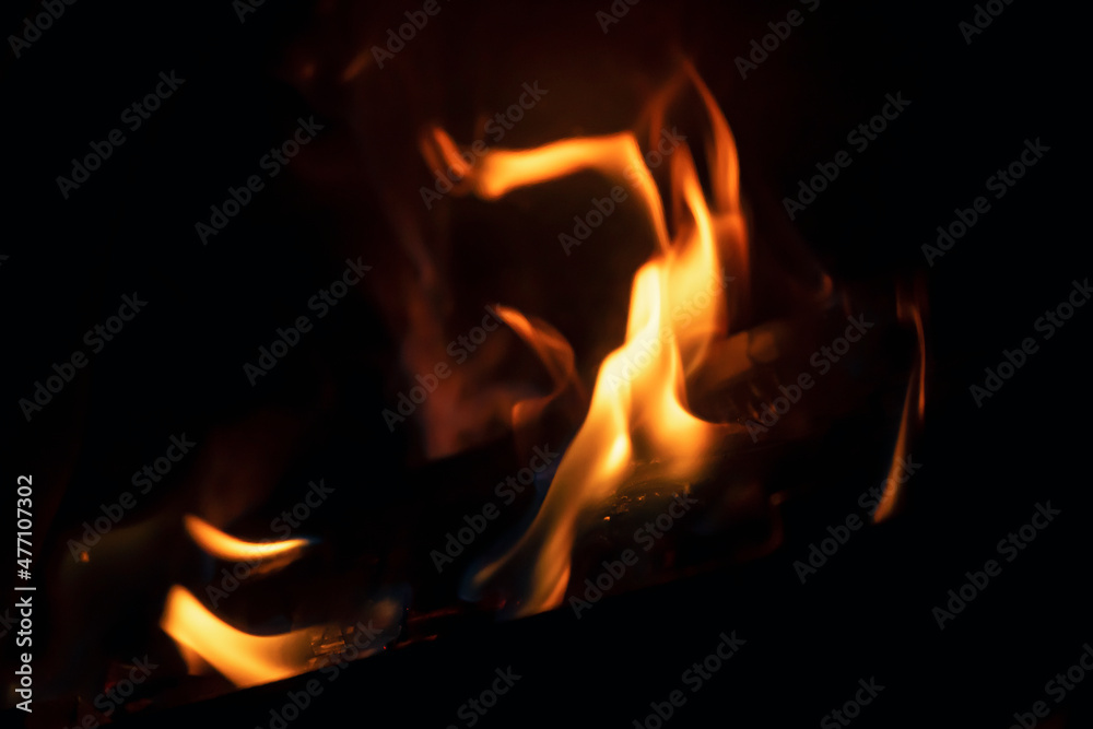 A tongue of flame bursting into flames. The budding of a fire. The flame looks like a burning candle. Copy space. A tongue of flame bursting into flames. The budding of a fire. The flame looks like a burning candle. Copy space.