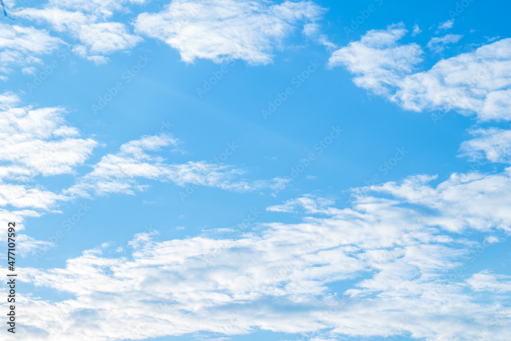 A view of the bright sky on a holiday afternoon with many white clouds lined up. It can be used as a wallpaper, suitable for weather-related tasks or weather and nature-related tasks.