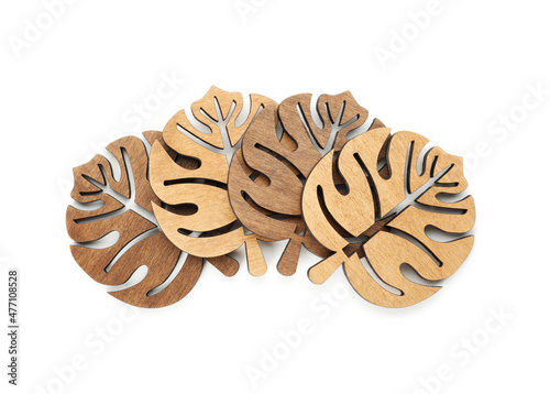 Leaf shaped wooden cup coasters on white background  top view