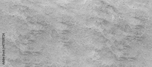 The gray and white cement floor used as a walkway or may be a cement floor on the walls in the construction can be used as a background image, suitable for architecture, design or house-related work.