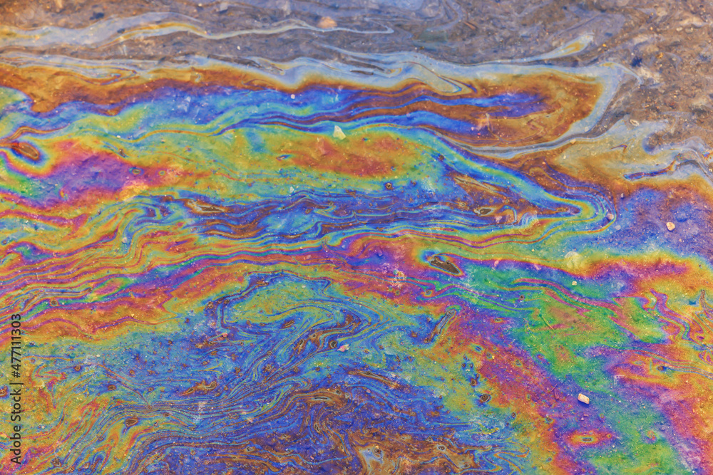 puddle gasoline background, wet oil multicolored rainbow pollution spill puddle gasoline background, wet oil multicolored rainbow pollution spill