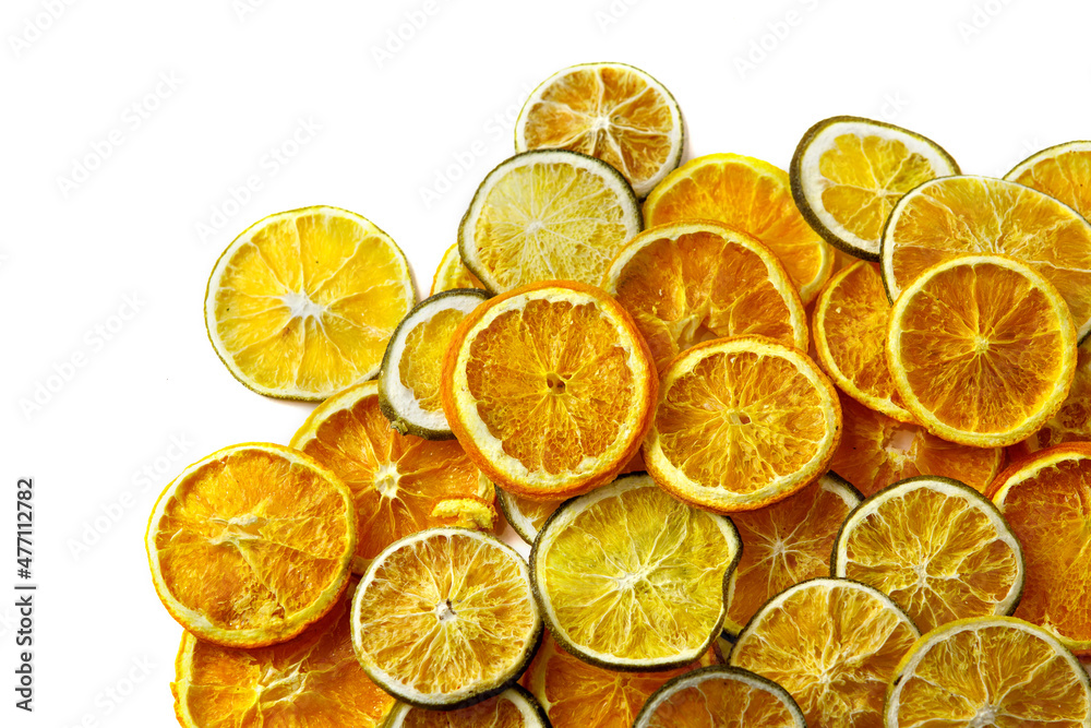 Dried slices of orange and lemon on a white Dried slices of orange and lemon on a white