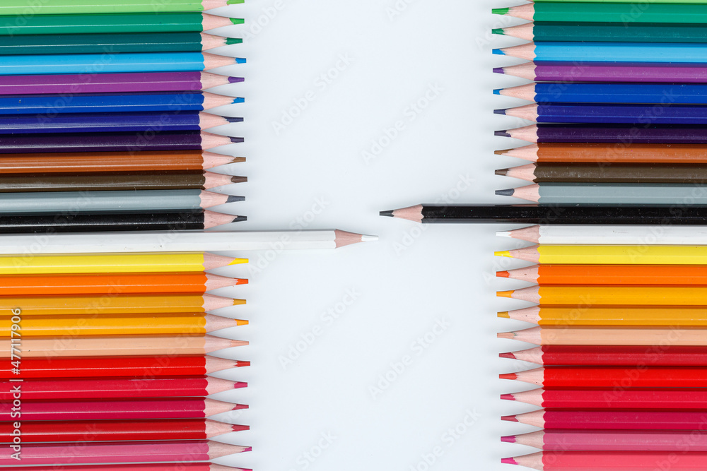 Multi-colored pencils in a row Multi-colored pencils in a row