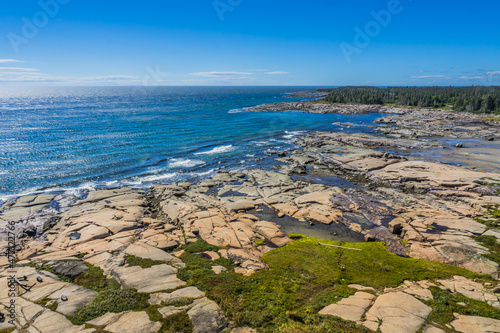 View on the St Lawrence estuary shoreline from the top of the Pointe-des-Monts lighthouse, in Cote Nord region of Quebec, Canada